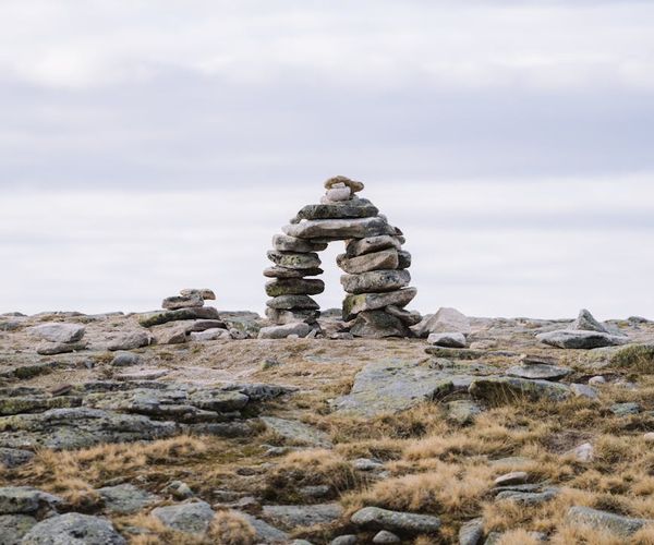 Calm natural scene with balanced stones, symbolizing stability.